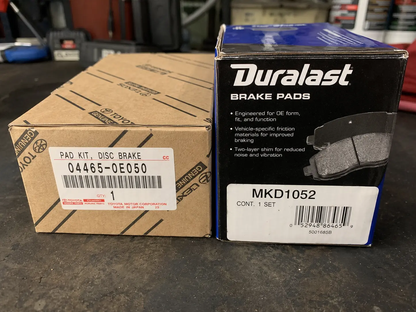 OEM brake pads packaging next to a Bosch aftermarket equivalent showing part numbers