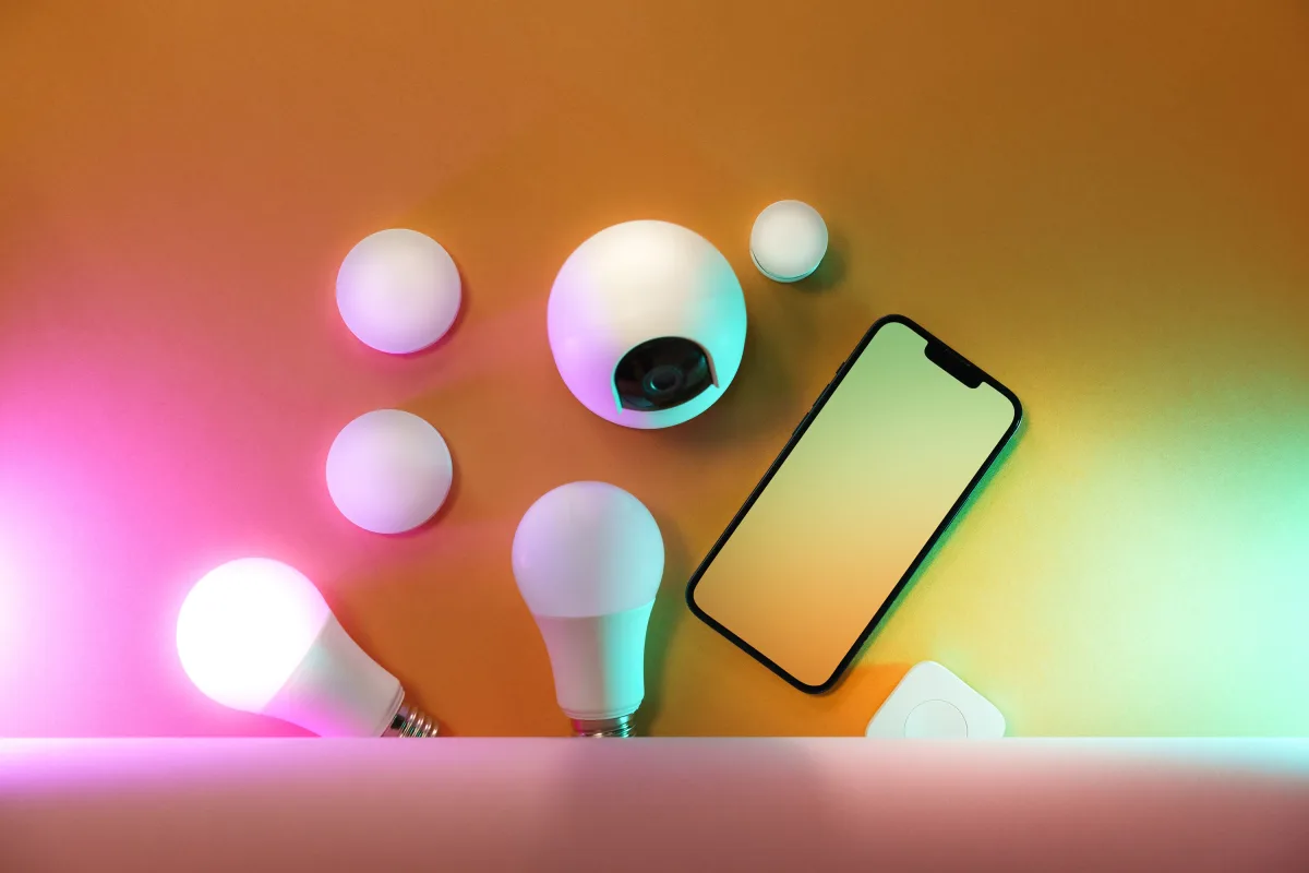 Collection of smart home devices including light bulbs and smartphone — Philips Hue smart lighting setup 2026