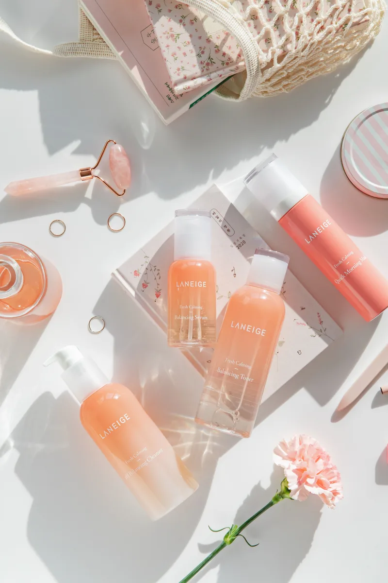 Flat lay of skincare products including serum, moisturizer, and SPF for a complete morning routine