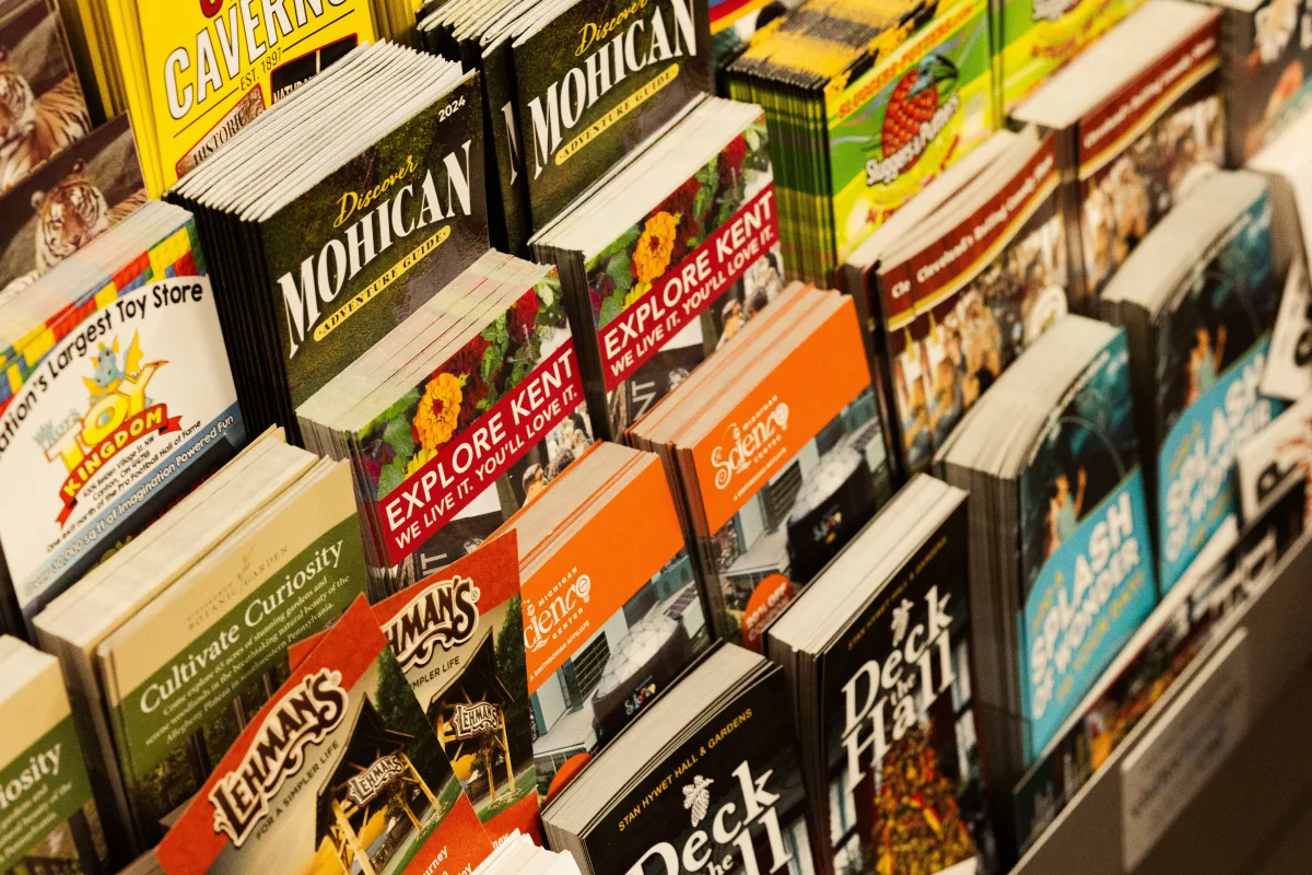 Display of colorful travel package brochures