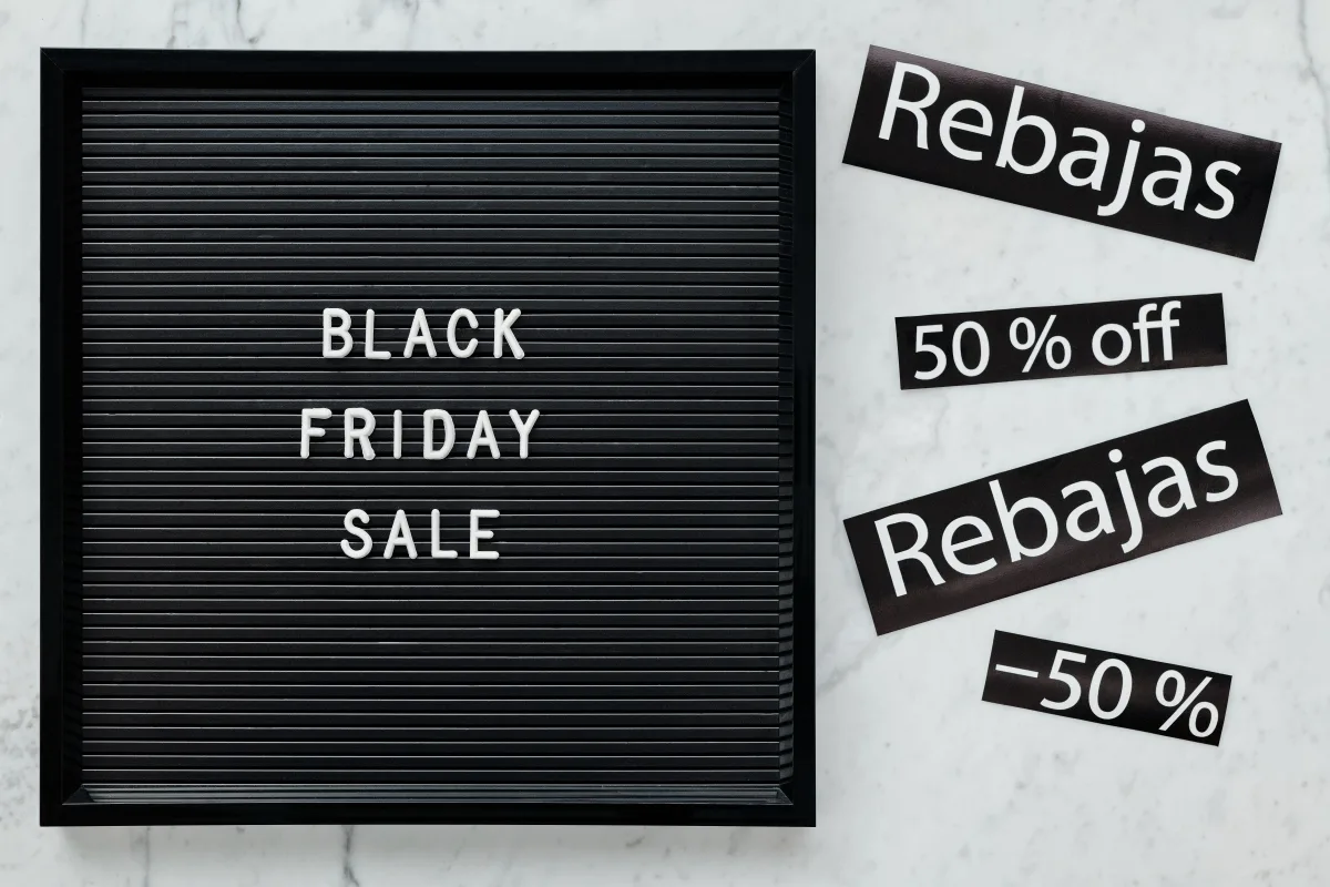 Black Friday sale signage with large discount percentages — illustrating manufactured discount tactics