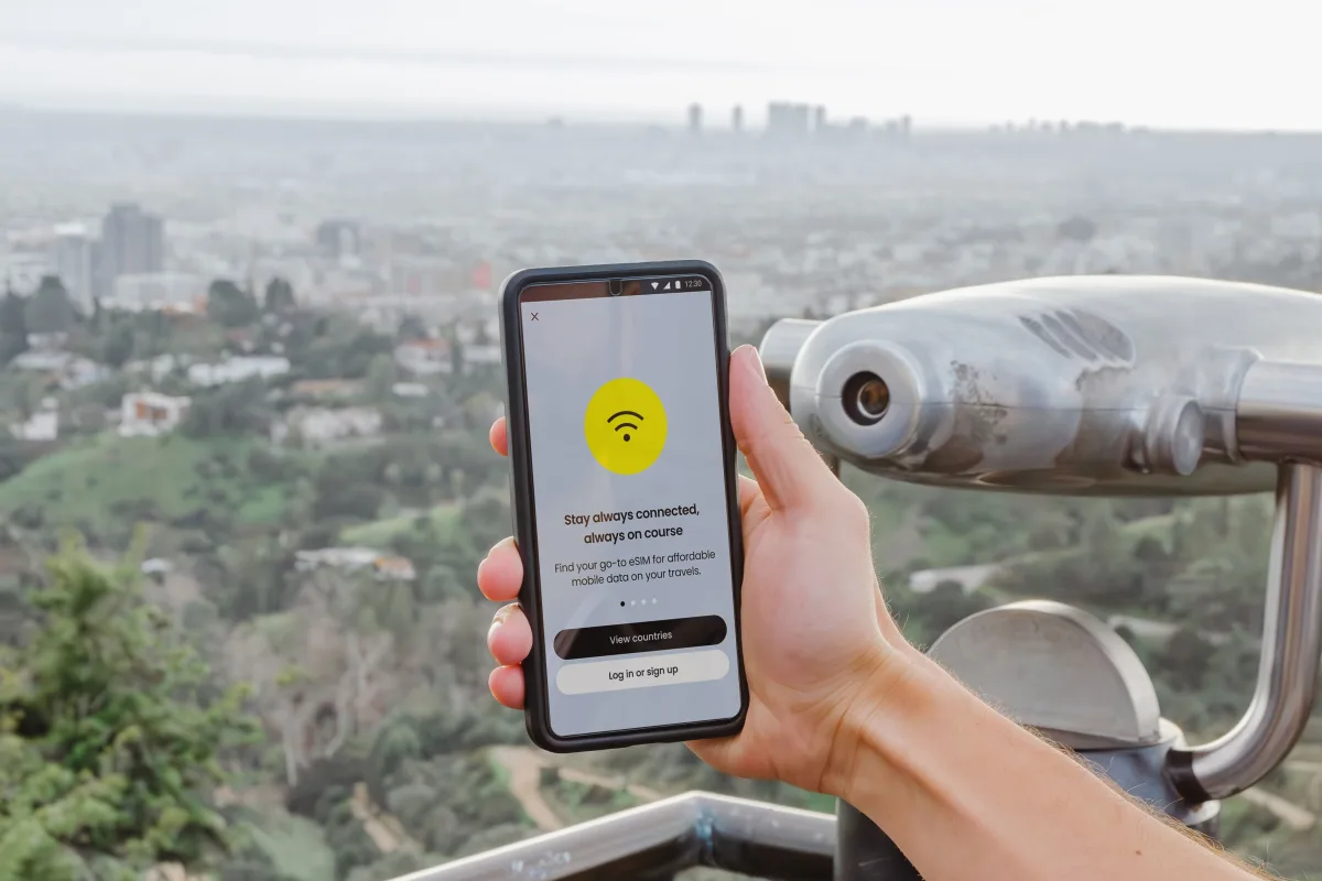 Smartphone displaying connectivity app with city skyline
