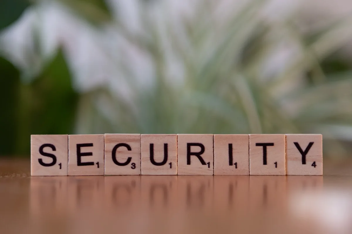 Wooden Scrabble tiles spelling SECURITY on a flat surface