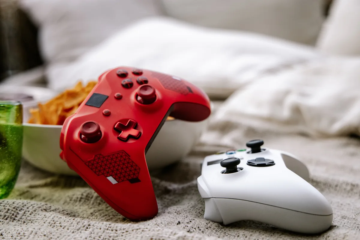 Xbox controller placed on a cozy blanket in casual gaming setup