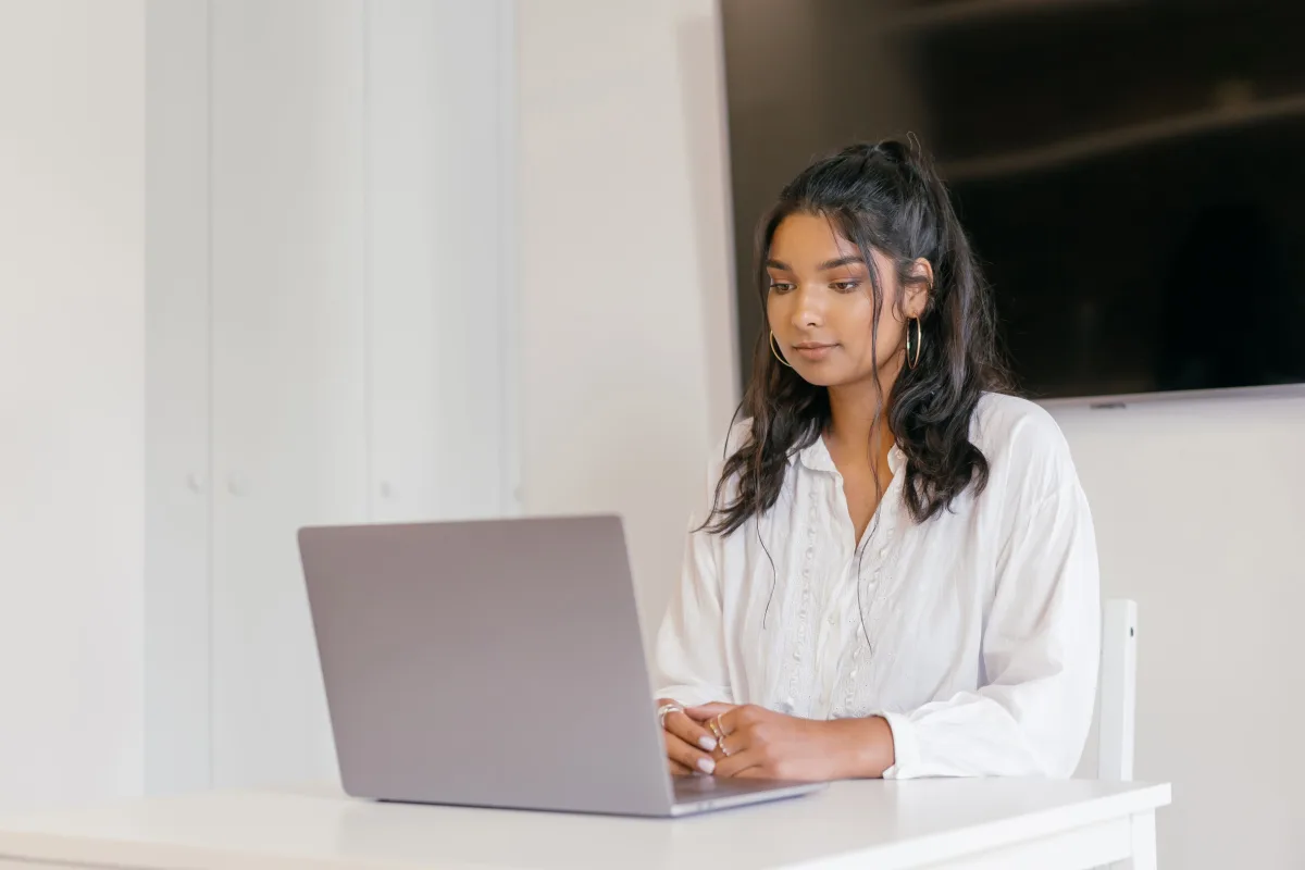 Woman studying on laptop at home for online learning subscription