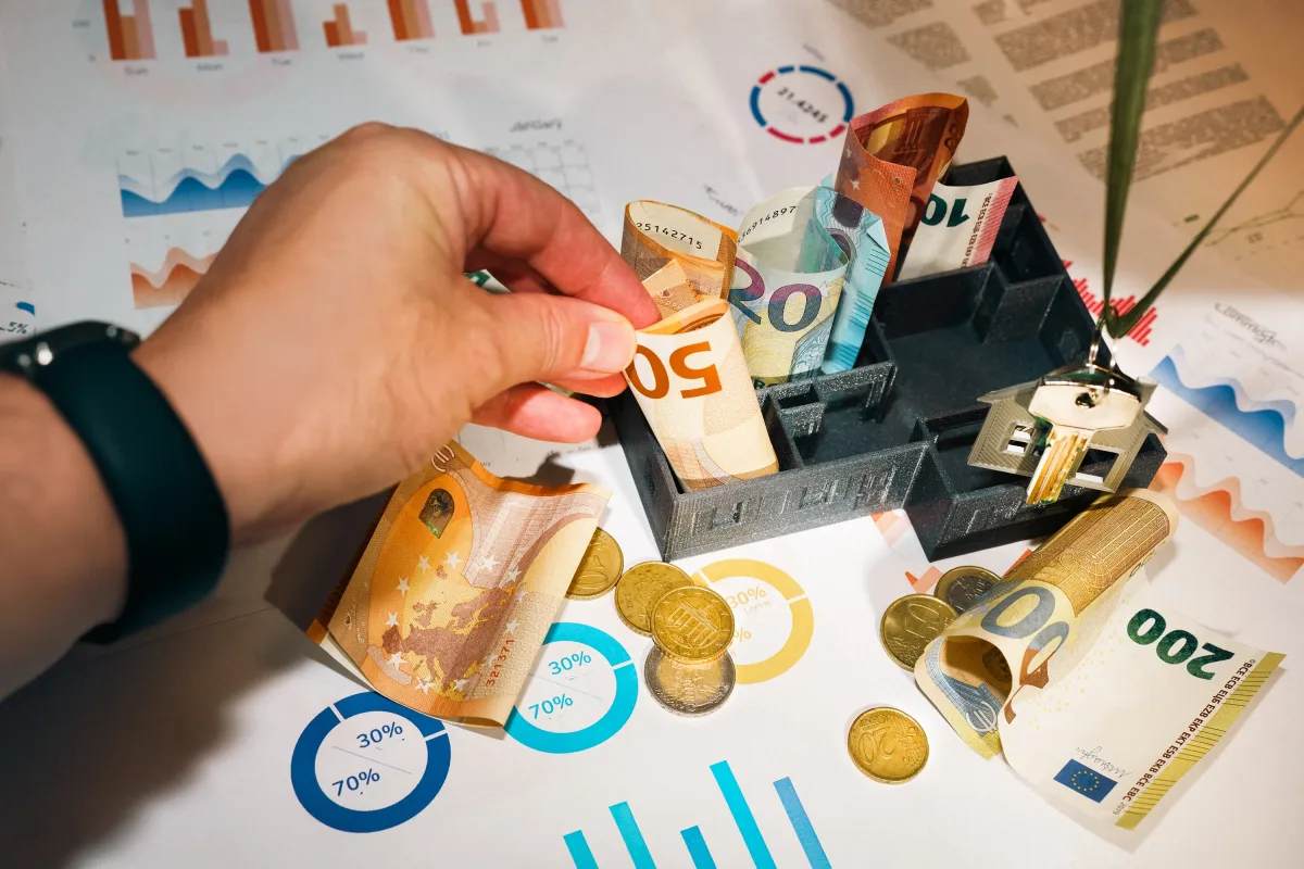 Calculator and financial charts for insurance cost planning