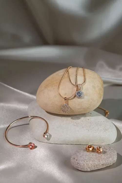 Jewelry display case showing rings and necklaces in a retail showroom, illustrating in-store jewelry buying