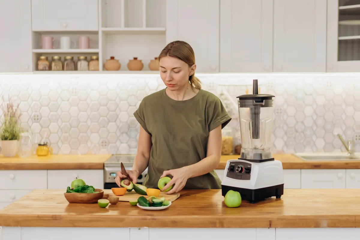Modern kitchen countertop with blender and fresh ingredients — comparing footprint sizes