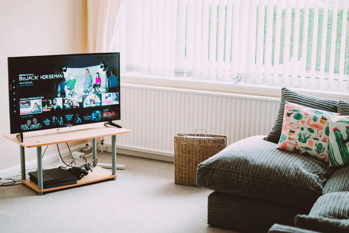 Modern living room with flat-screen TV on a wood media console