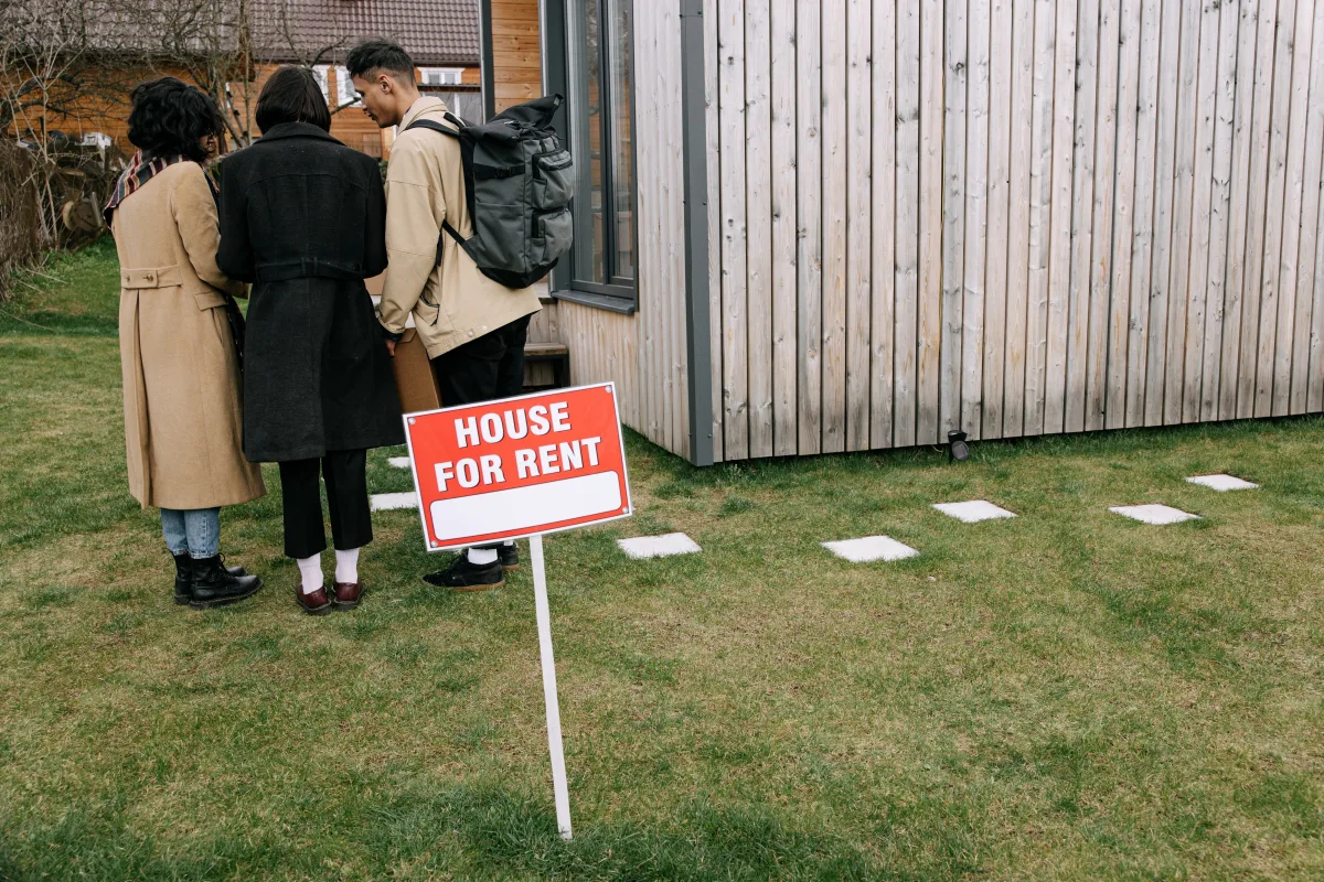 Couple reviewing renters insurance documents in a furnished apartment