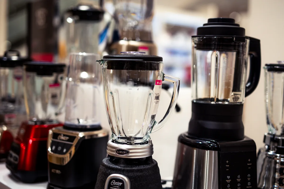 Assorted kitchen blenders on a showroom countertop — Vitamix, Ninja, and NutriBullet models 2026