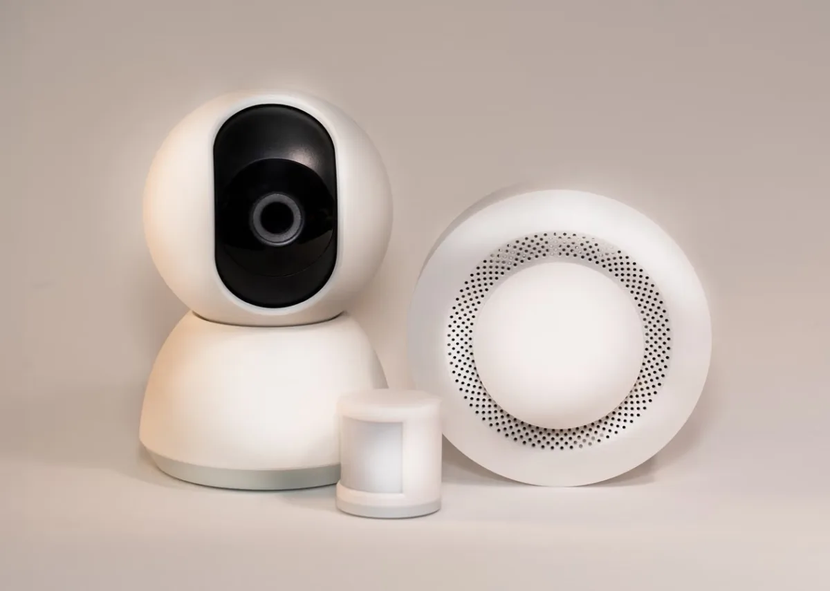 Modern smart home security devices with motion sensor and hub