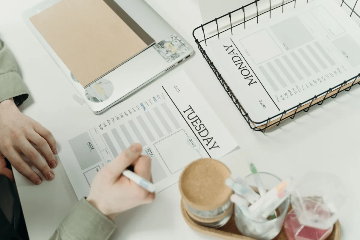 Team planning weekly schedule with detailed project planner