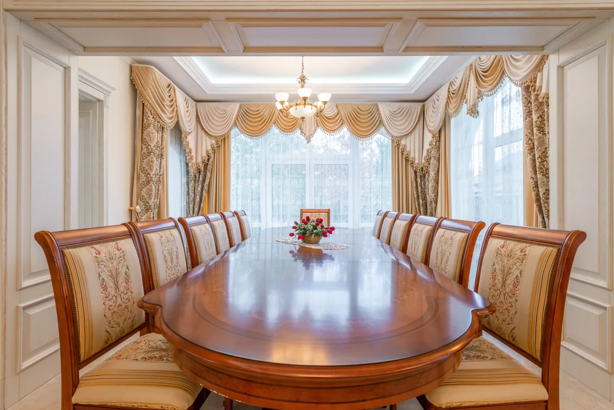 Modern dining room with a solid wood rectangular table and upholstered chairs