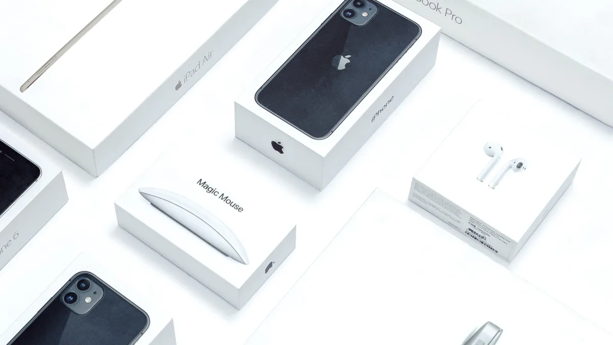 Flat lay of consumer electronics packaging on a desk