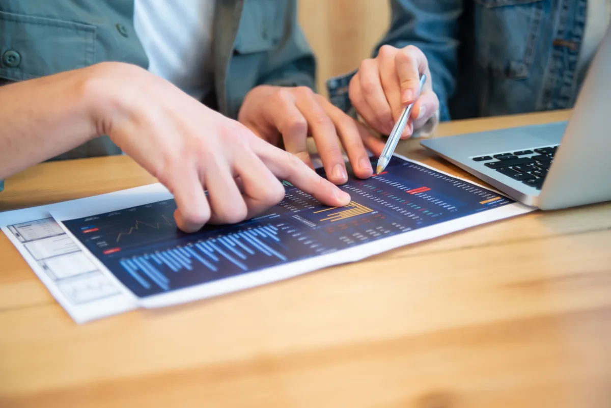 Advisor and client reviewing retirement planning charts together