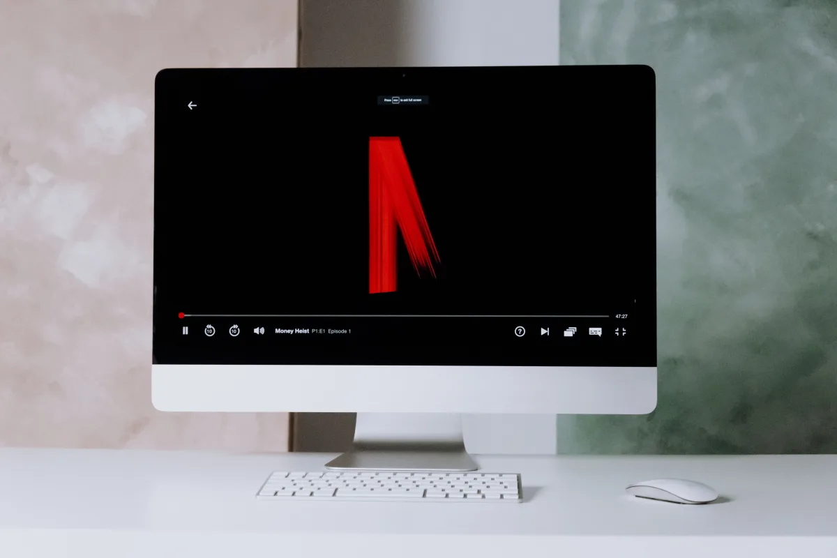 Netflix on iMac desktop with keyboard — software and streaming subscription