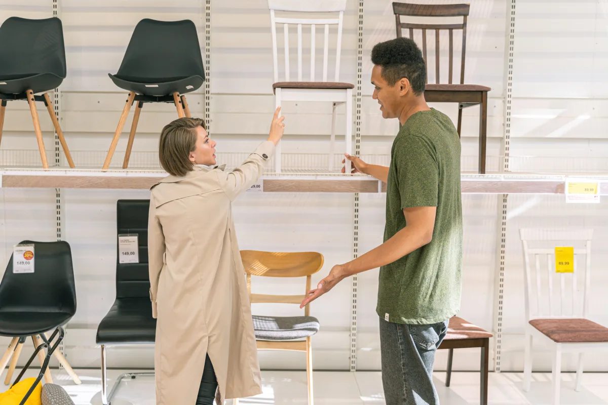Couple exploring furniture options in a modern showroom