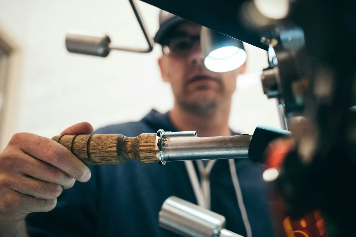 Cordless power tools including impact wrench and drill on workshop bench