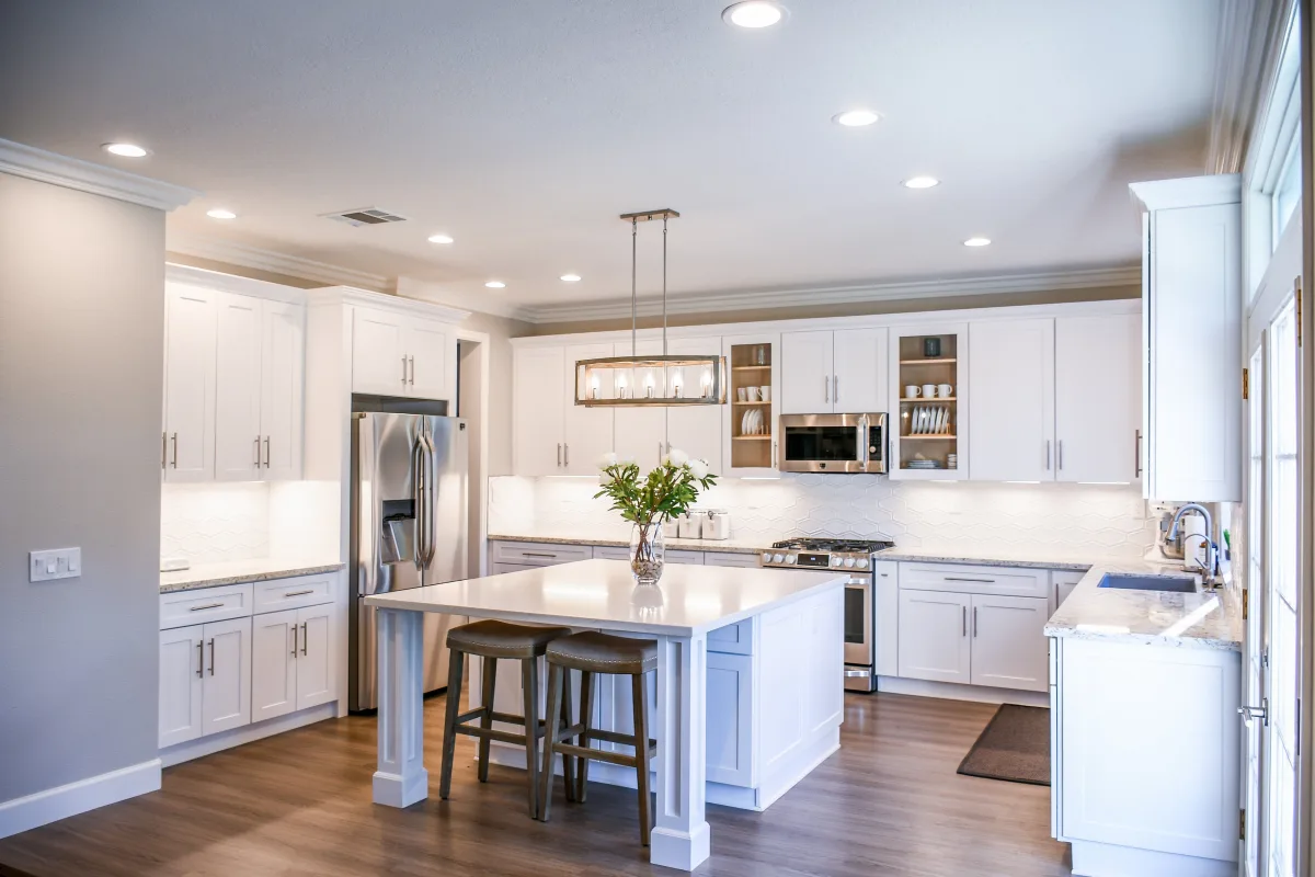 Modern kitchen with induction cooktop and stainless steel cookware set