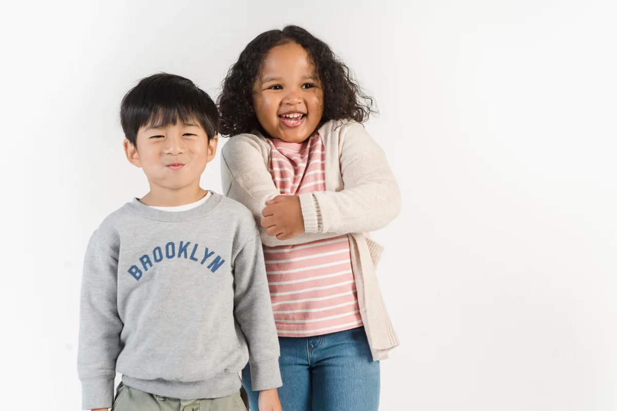 Multiethnic children smiling in colorful casual clothes