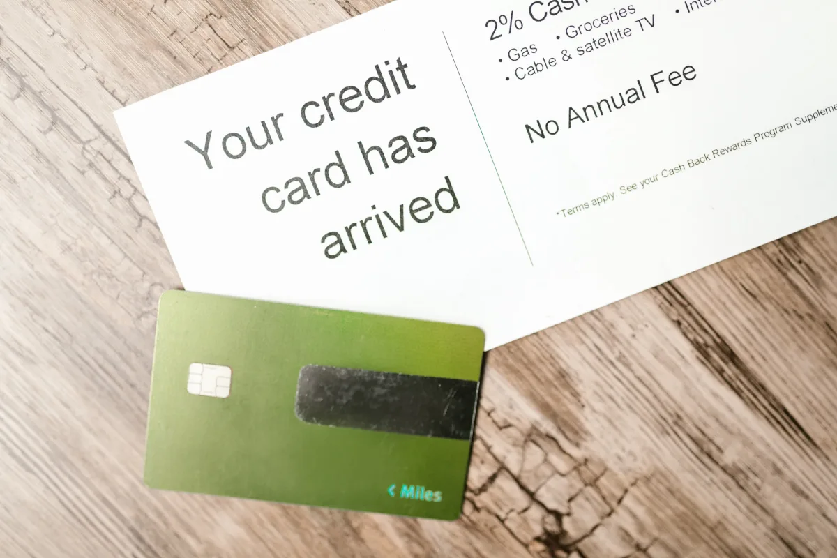 New credit card arriving in mail with cashback offer text visible