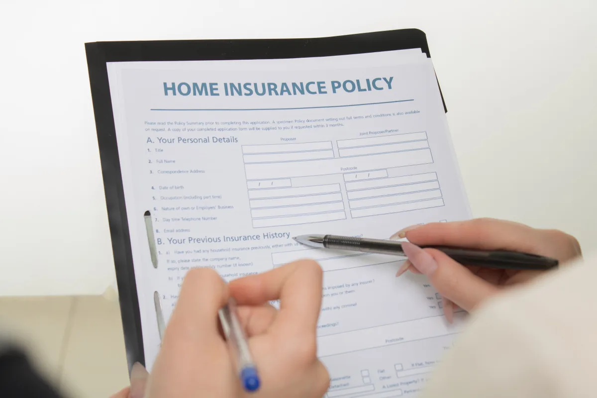 Person carefully reviewing life insurance policy documents