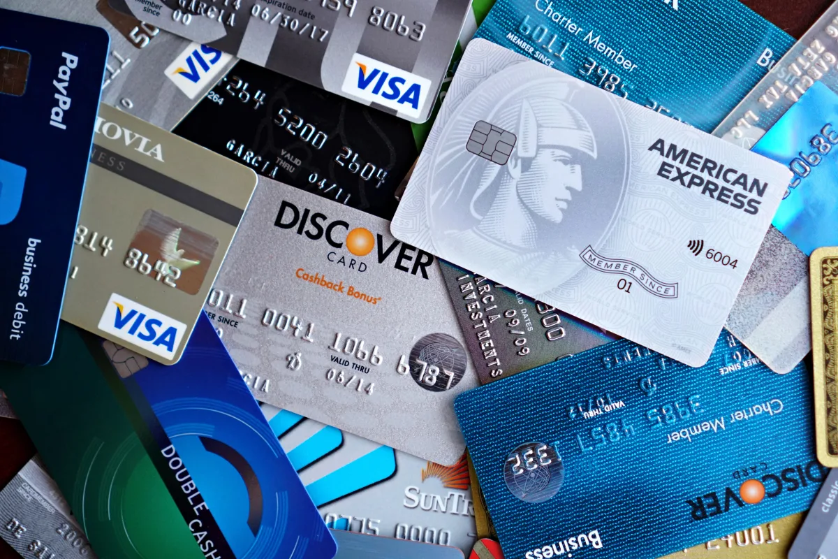 Close-up of Visa, Mastercard, and Amex credit cards pile