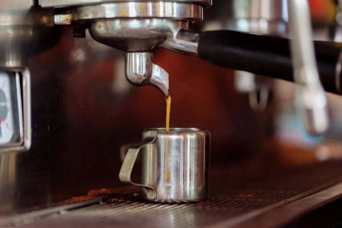 Barista brewing espresso in a café — Hario V60 pour-over and AeroPress manual brewing 2026