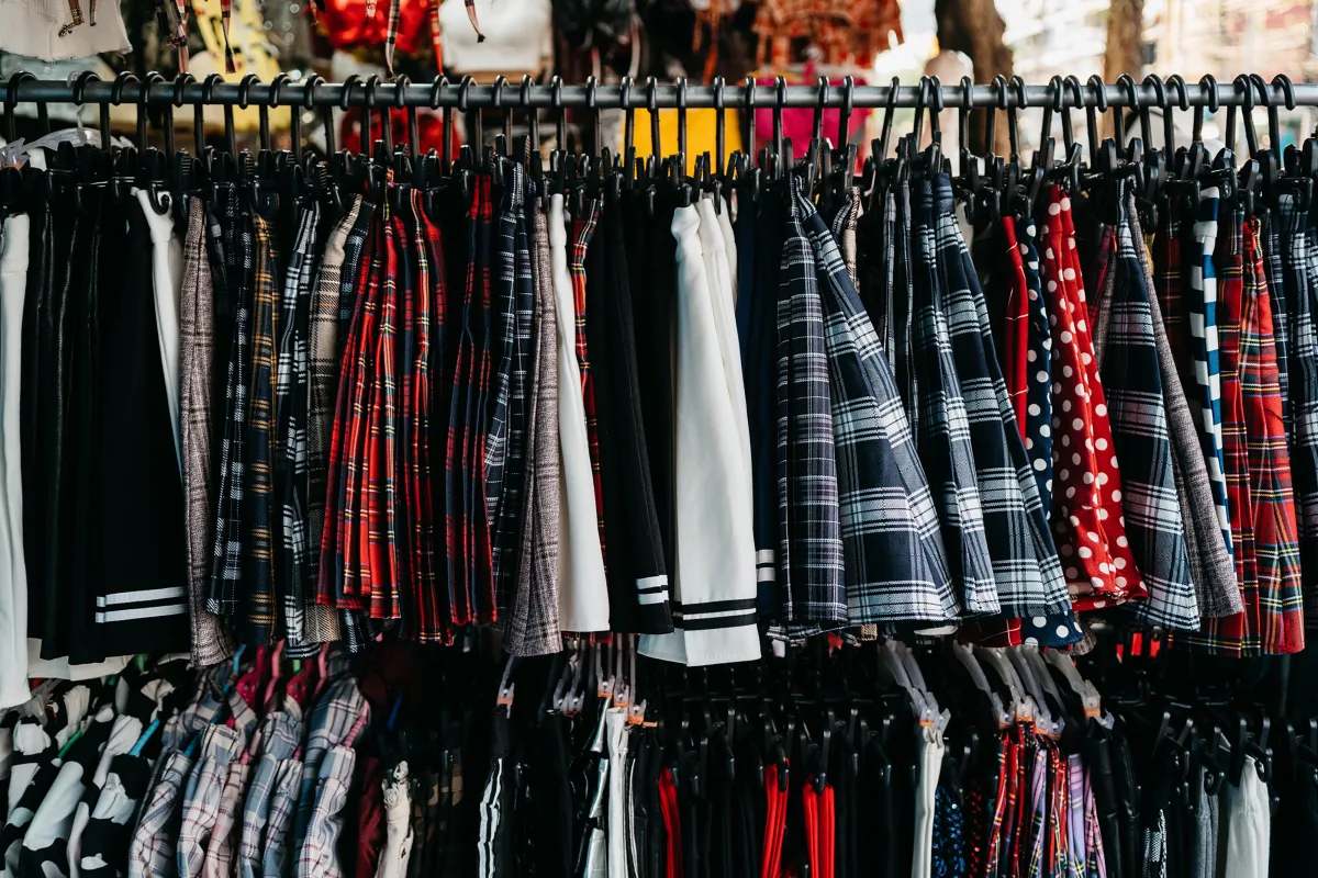 Colorful clothing hanging on retail racks