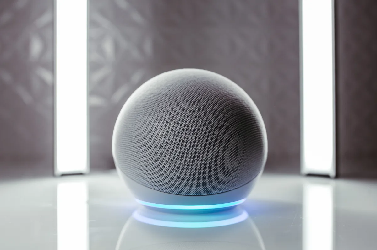 Spherical smart speaker with illuminated ring base in a modern interior — Google Nest Hub Max smart home 2026