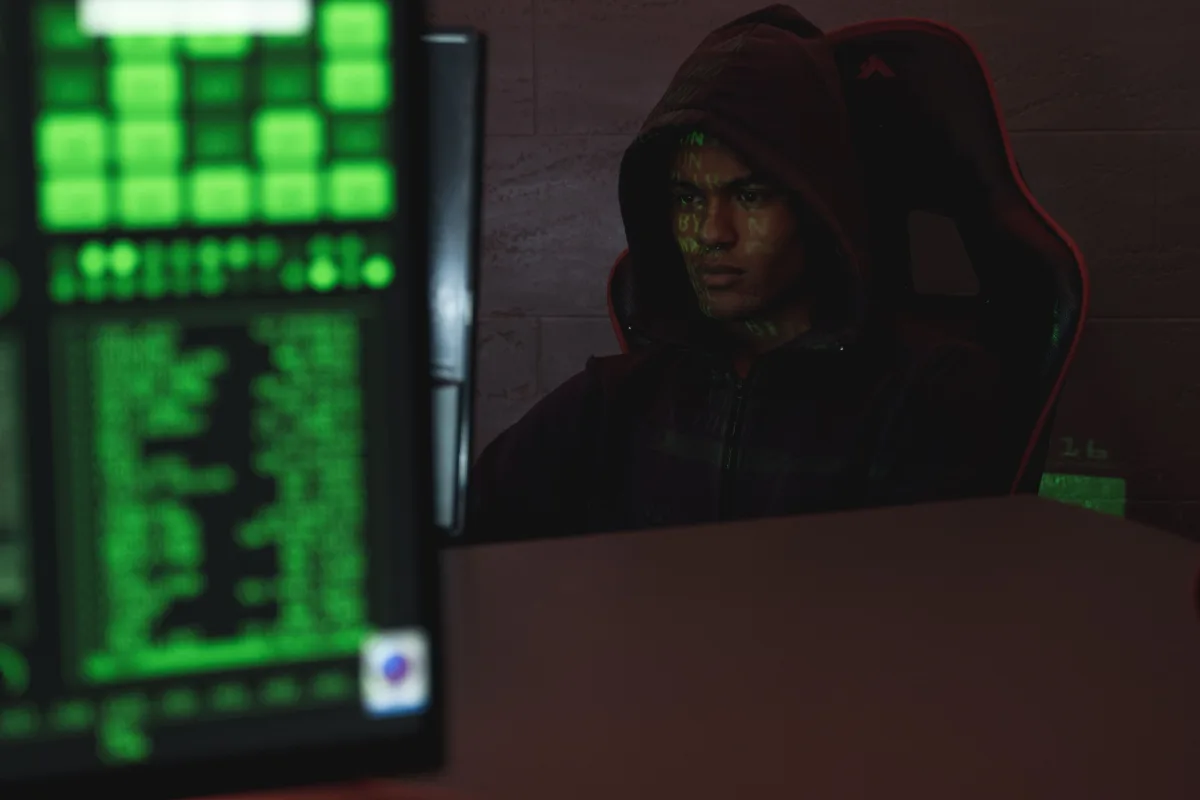 Programmer focused on computer screen showing security code