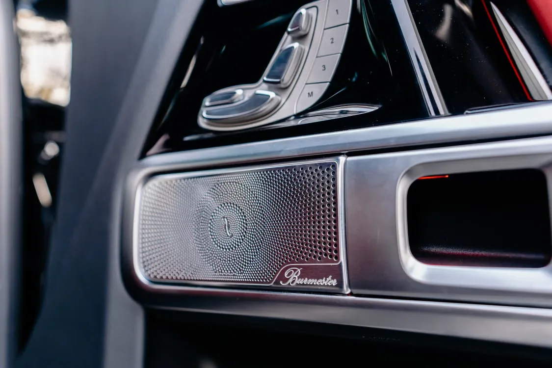 Modern car interior detail showing speaker and luxury trim