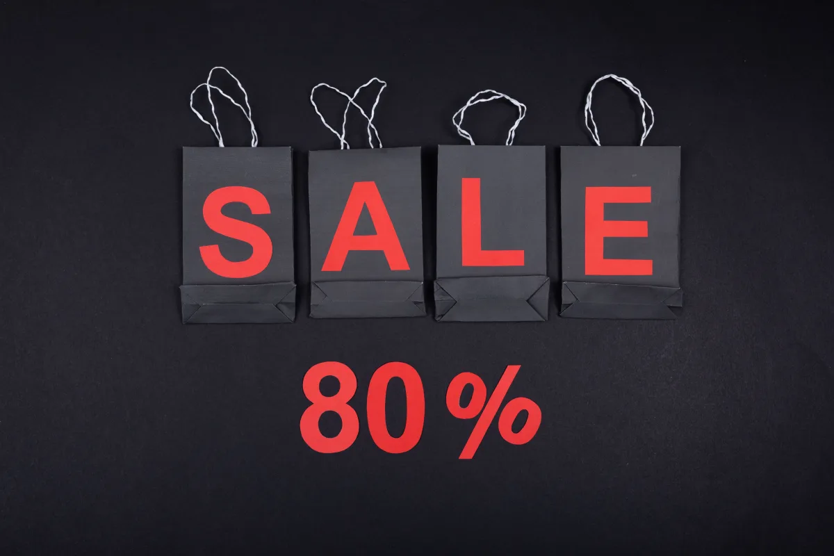 Shopping bags with sale discount tags — representing deal alert apps and price tracking