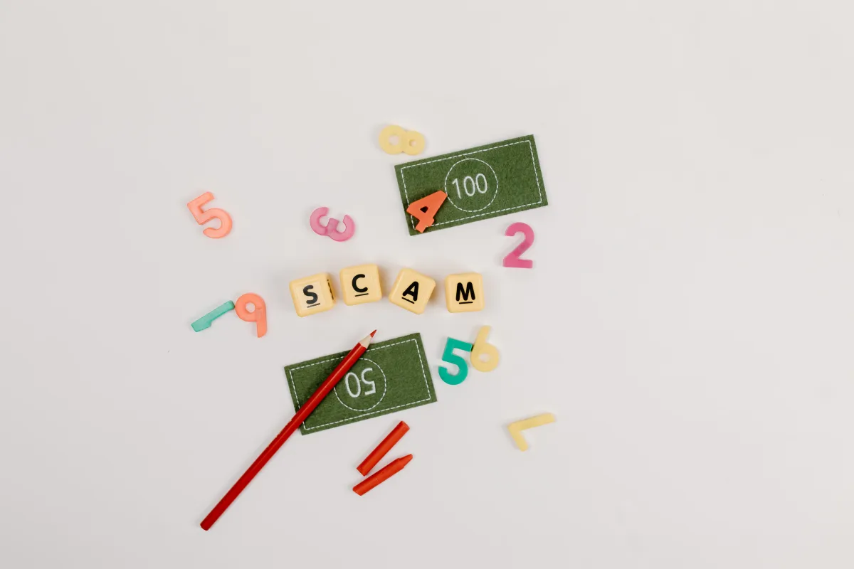 Creative flatlay depicting scam concept with play money and numbers