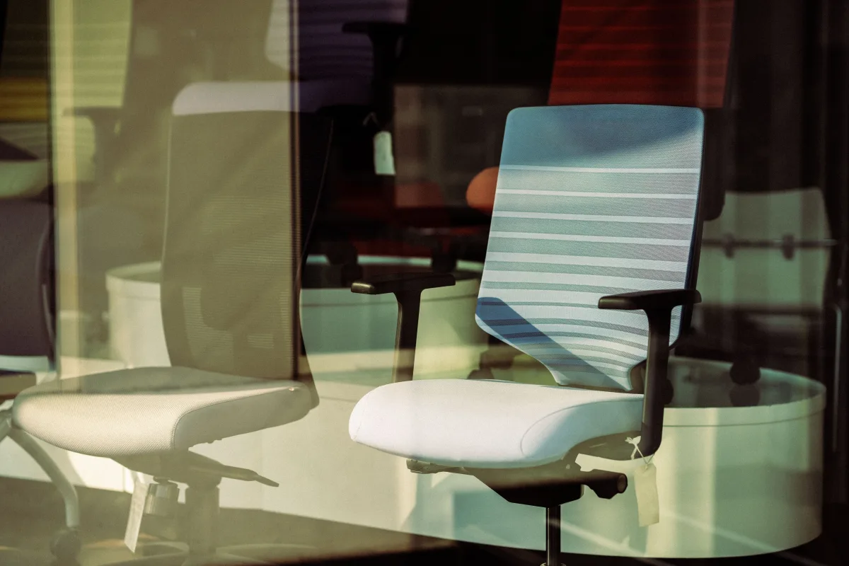 Contemporary ergonomic office chairs shown in modern showroom setting