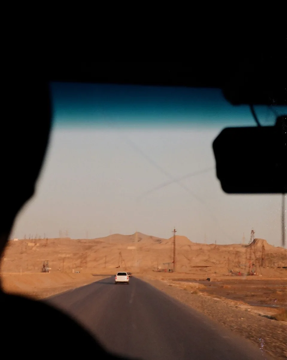 View of open road through a car windshield — perspective from driver's seat