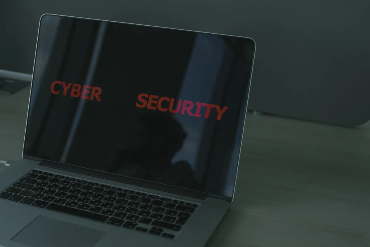 Close-up of a laptop screen displaying cybersecurity text