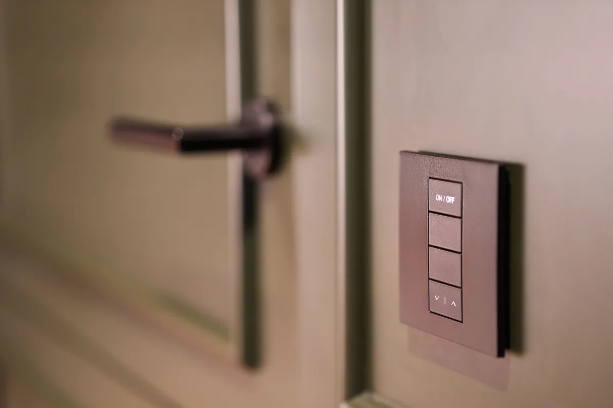 Smart home wall panel next to a modern interior door