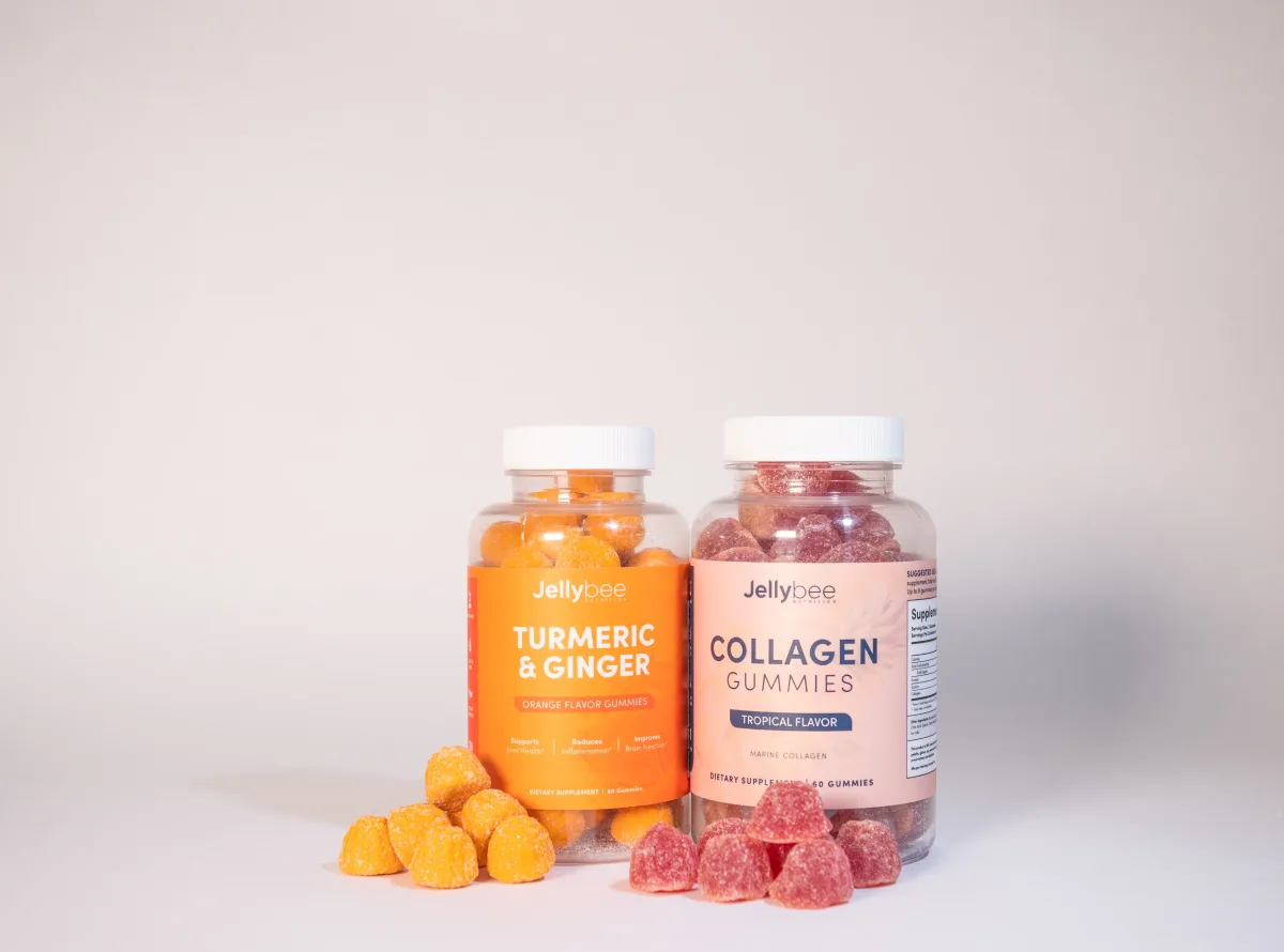 Turmeric ginger and collagen gummy products on white surface