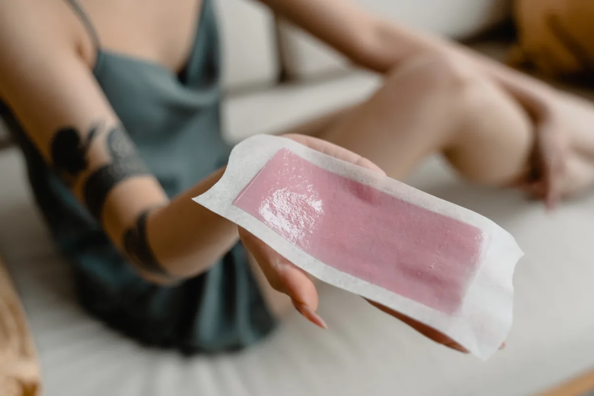 Close-up of a woman's legs during a professional waxing session