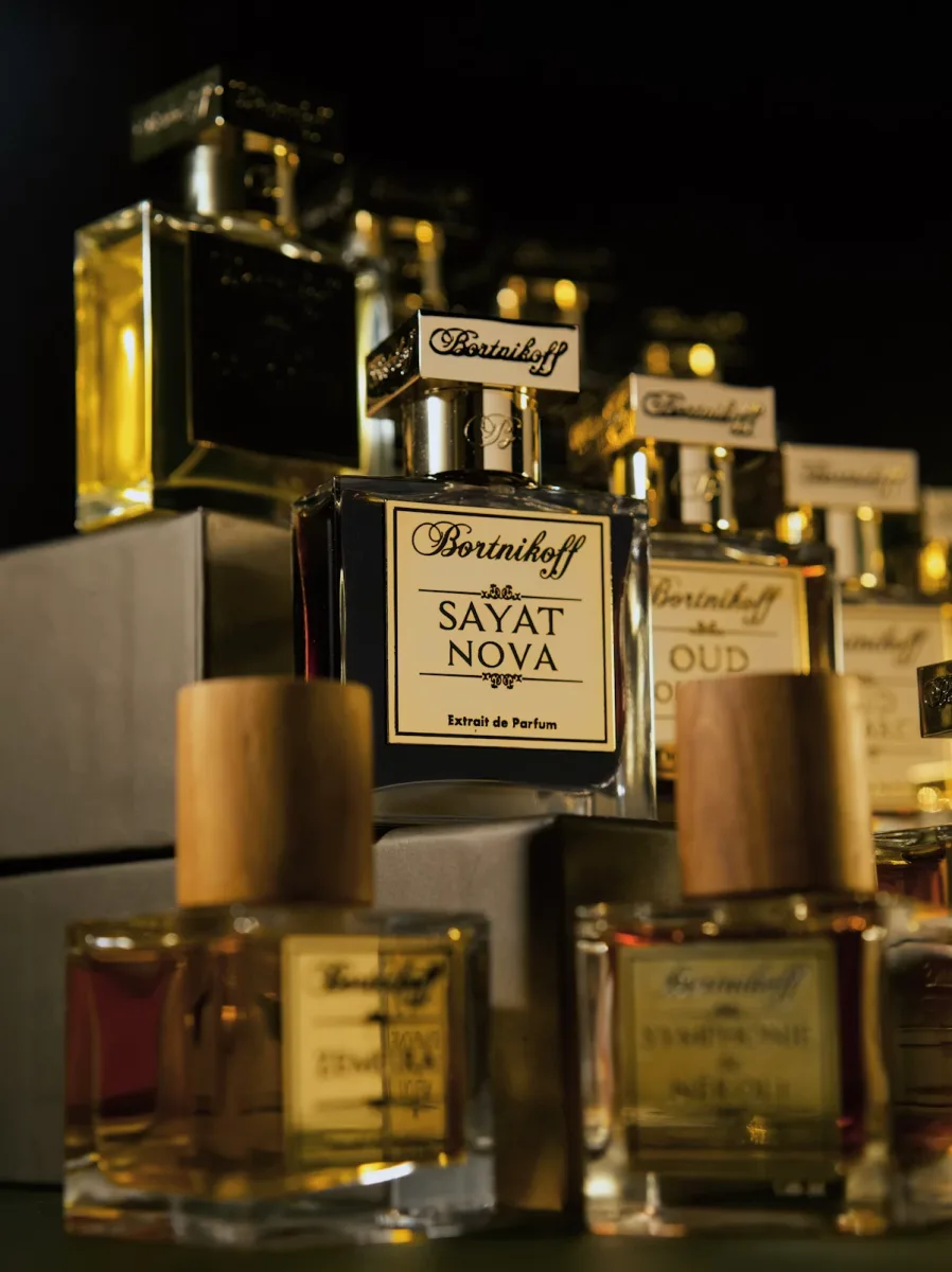 A display of different niche perfume bottles in a collection