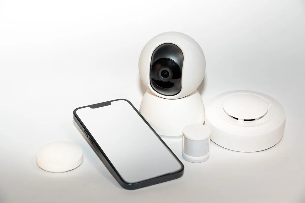 Collection of smart home security gadgets including sensors and cameras