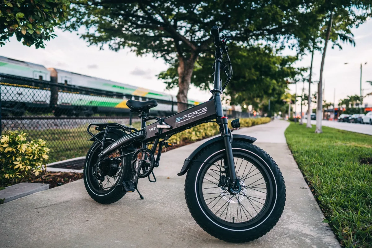 Compact folding electric bike parked on an urban sidewalk