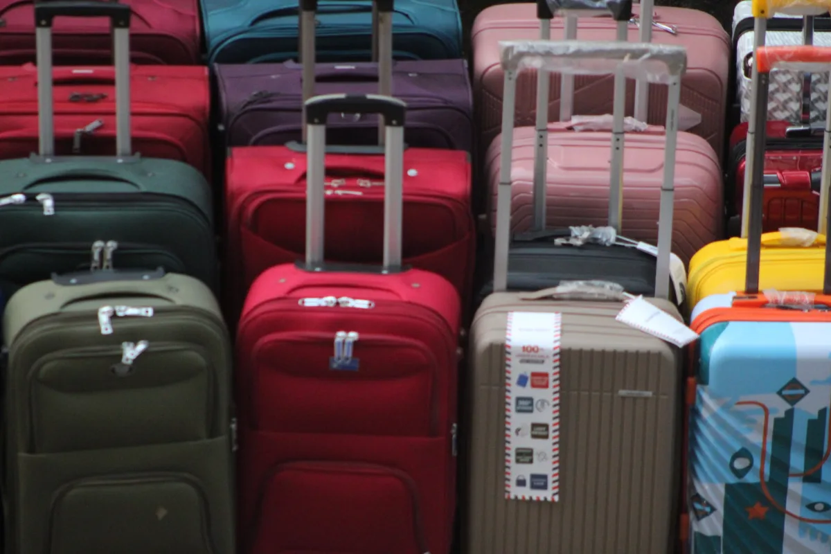 Colorful suitcases stacked and ready for travel
