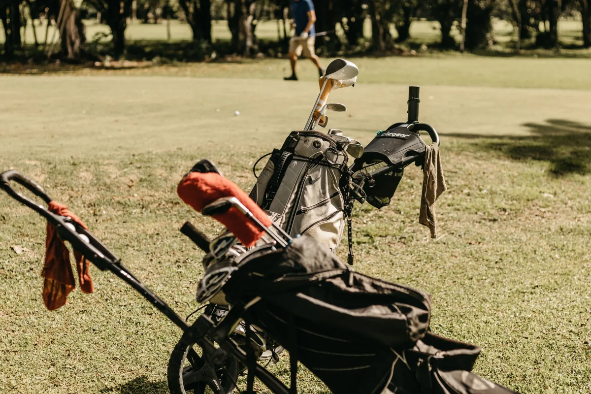 Golfer using a laser rangefinder on course — best value options 2026