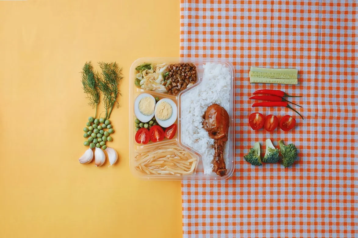 Assorted fresh food ingredients laid out on a kitchen counter — meal kit preparation concept