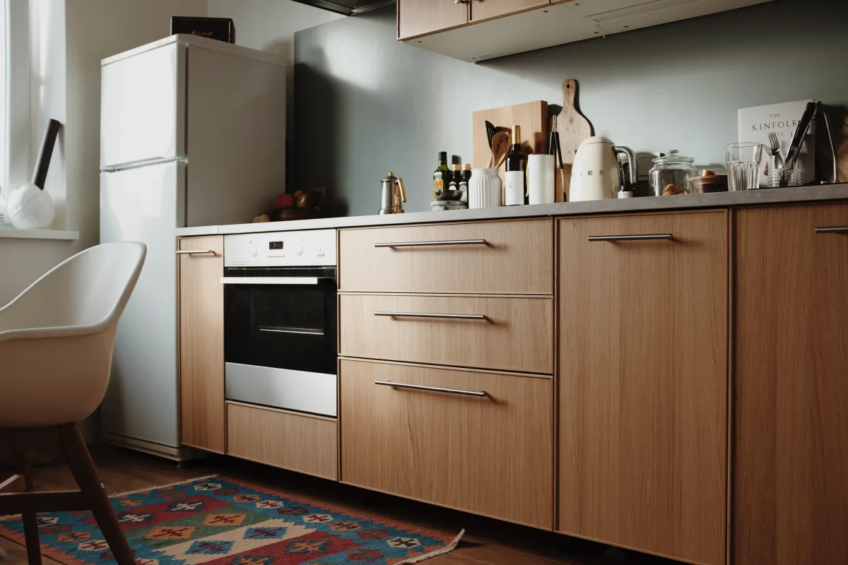 Modern kitchen with wooden cabinets and integrated appliances