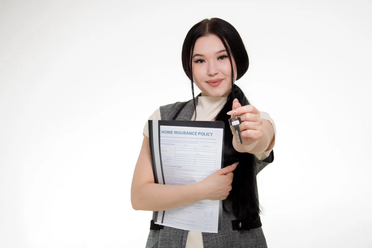 Woman smiling while reviewing a renters insurance policy document