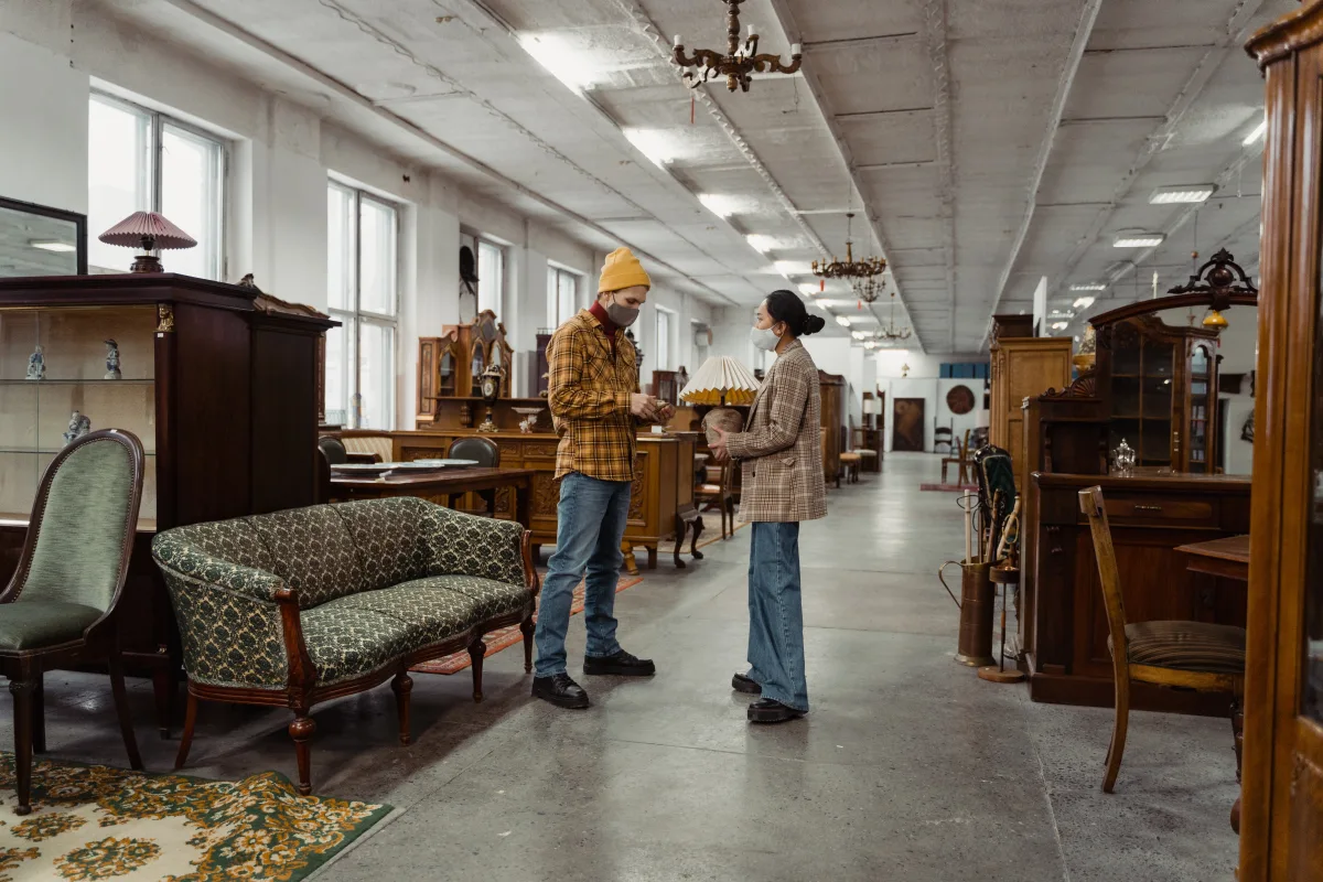Couple in furniture store examining a chair